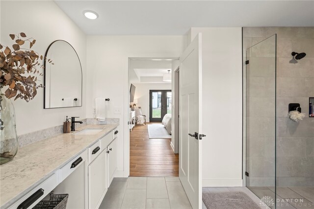 2164 Northbridge Trl, Troy, OH 45373 - bathroom featuring tile patterned flooring, a walk in shower, vanity, and ensuite bath