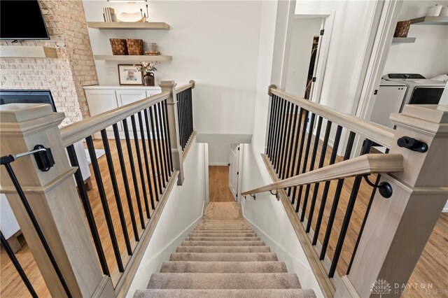 2164 Northbridge Trl, Troy, OH 45373 - stairway featuring washer and dryer, wood finished floors, and baseboards