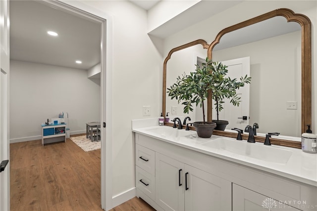 2164 Northbridge Trl, Troy, OH 45373 - full bath featuring wood finished floors, double vanity, recessed lighting, and baseboards