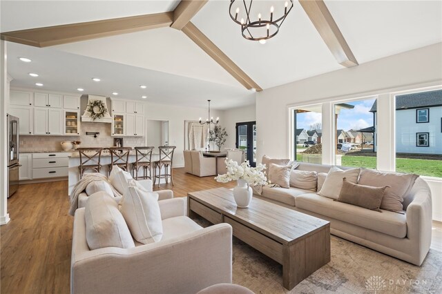 2164 Northbridge Trl, Troy, OH 45373 - living area with a chandelier, light wood-style floors, beam ceiling, recessed lighting, and high vaulted ceiling