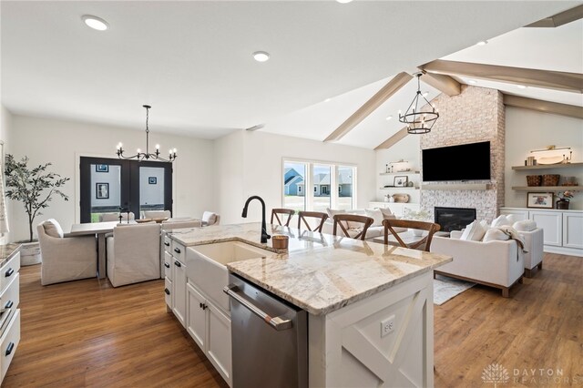 2164 Northbridge Trl, Troy, OH 45373 - kitchen featuring dishwasher, a chandelier, a sink, open floor plan, and recessed lighting