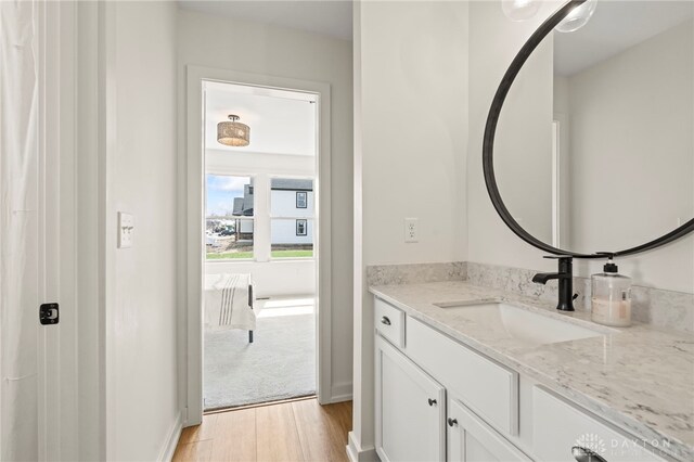 2164 Northbridge Trl, Troy, OH 45373 - bathroom featuring wood finished floors, vanity, and baseboards