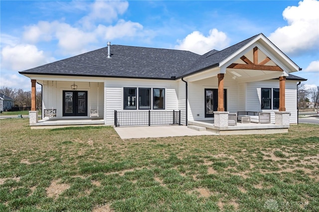 2164 Northbridge Trl, Troy, OH 45373 - back of property featuring a yard, a shingled roof, and an outdoor hangout area