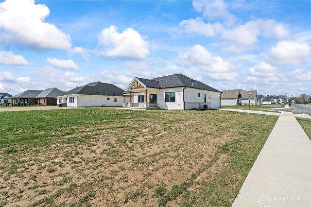 2164 Northbridge Trl, Troy, OH 45373 - view of property exterior with concrete driveway, a garage, a yard, and a residential view