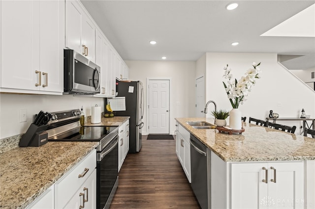 3059 Canvasback Ct, Franklin Twp, OH 45005 - kitchen featuring a sink, white cabinets, a center island with sink, and stainless steel appliances