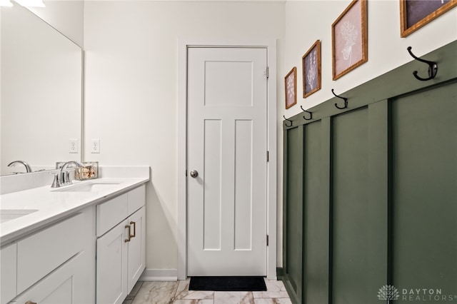 3059 Canvasback Ct, Franklin Twp, OH 45005 - bathroom featuring baseboards, double vanity, marble finish floor, and a sink