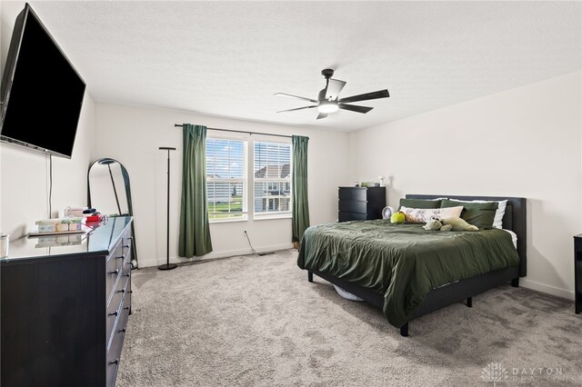 3059 Canvasback Ct, Franklin Twp, OH 45005 - carpeted bedroom with baseboards, ceiling fan, and a textured ceiling