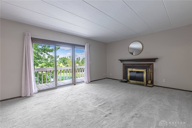 1739 Running Brook Trl Unit F, West Carrollton, OH 45449 - unfurnished living room featuring carpet, a glass covered fireplace, and baseboards