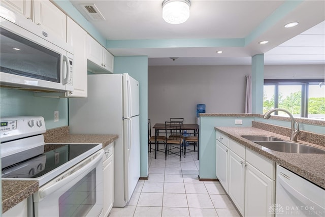 1739 Running Brook Trl Unit F, West Carrollton, OH 45449 - kitchen with white appliances, a sink, recessed lighting, white cabinetry, and light tile patterned flooring