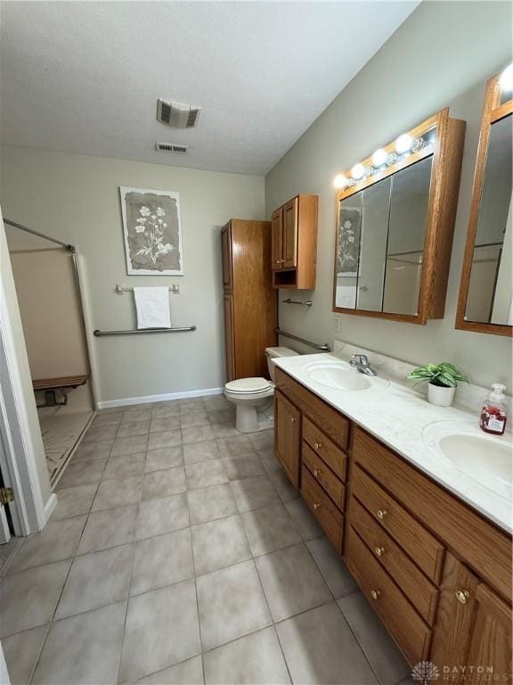 full bath featuring a sink, visible vents, and double vanity