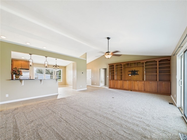 unfurnished living room featuring baseboards, a ceiling fan, vaulted ceiling, light colored carpet, and light tile patterned flooring