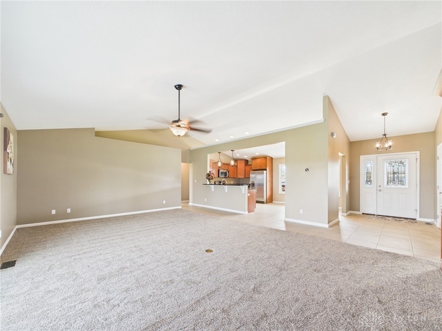 unfurnished living room featuring light tile patterned floors, light carpet, and lofted ceiling