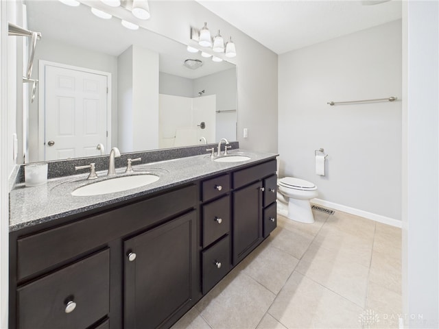 full bathroom with a sink, tile patterned floors, a shower, and toilet