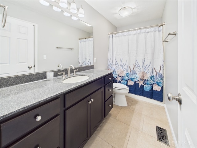 bathroom featuring vanity, visible vents, toilet, a shower with shower curtain, and tile patterned floors