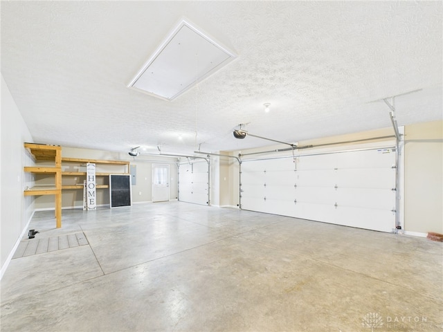garage featuring baseboards and a garage door opener