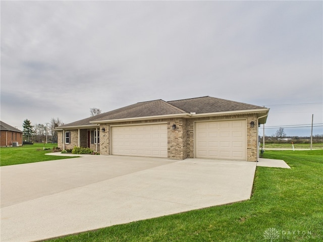 view of front of home with brick siding, a front lawn, an attached garage, and driveway