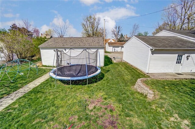 357 High St, Wilmington, OH 45177 - view of yard featuring a trampoline