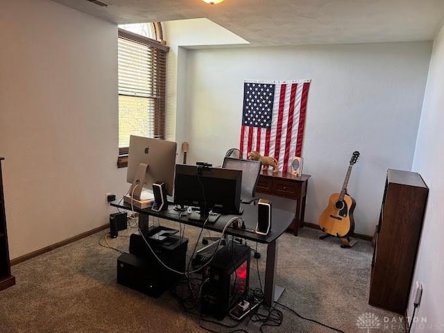 carpeted office space featuring baseboards