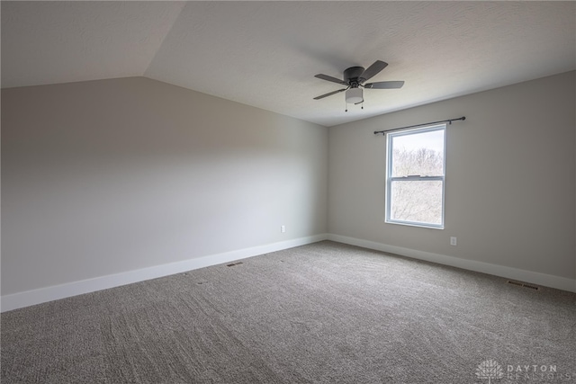 spare room with visible vents, baseboards, a ceiling fan, and carpet floors