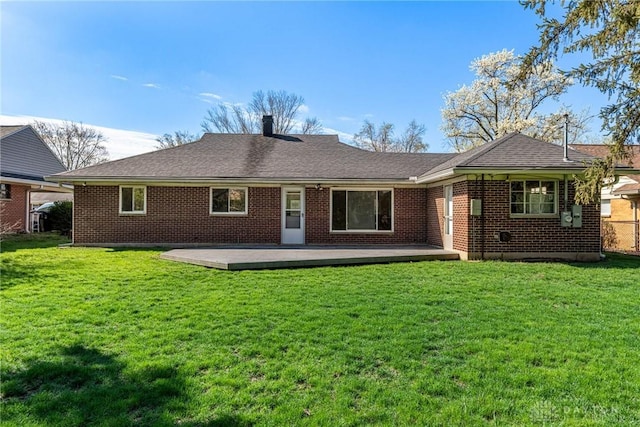 645 Brookfield Rd, Dayton, OH 45429 - back of house with a chimney, brick siding, a lawn, a deck, and roof with shingles