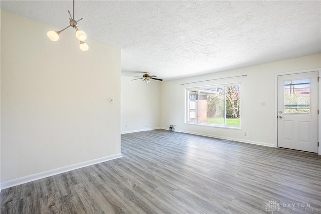 645 Brookfield Rd, Dayton, OH 45429 - unfurnished living room featuring a textured ceiling, wood finished floors, and a ceiling fan