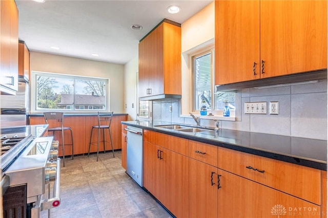 645 Brookfield Rd, Dayton, OH 45429 - kitchen featuring dishwasher, decorative backsplash, dark countertops, range, and recessed lighting