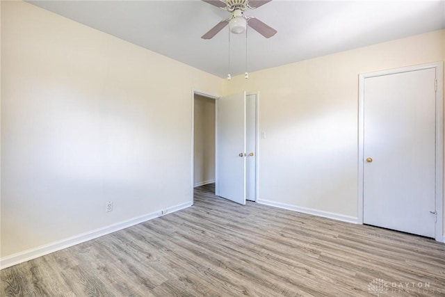 645 Brookfield Rd, Dayton, OH 45429 - unfurnished bedroom featuring light wood-style floors and a ceiling fan