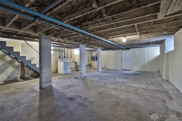 basement with washer / clothes dryer and stairs