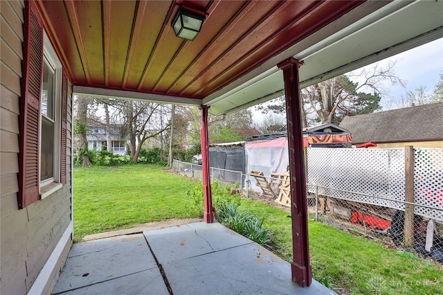 view of patio featuring fence