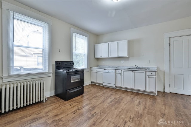 kitchen featuring white cabinets, dishwasher, a sink, black electric range oven, and radiator