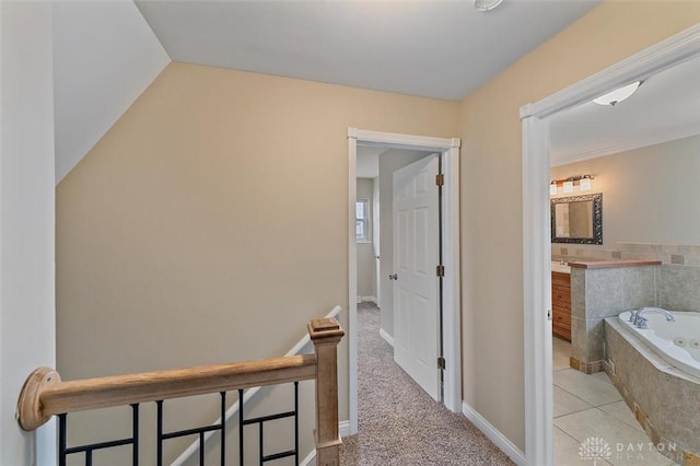 721 Trafalgar Ct, Middletown, OH 45044 - hall with baseboards, vaulted ceiling, and light carpet