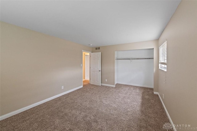 721 Trafalgar Ct, Middletown, OH 45044 - unfurnished bedroom with carpet flooring, baseboards, and a closet