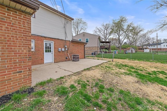 721 Trafalgar Ct, Middletown, OH 45044 - rear view of house with a patio area, brick siding, and central AC