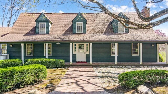 4600 Brown Rd, Sugarcreek Township, OH 45440 - view of front of property featuring a porch and roof with shingles