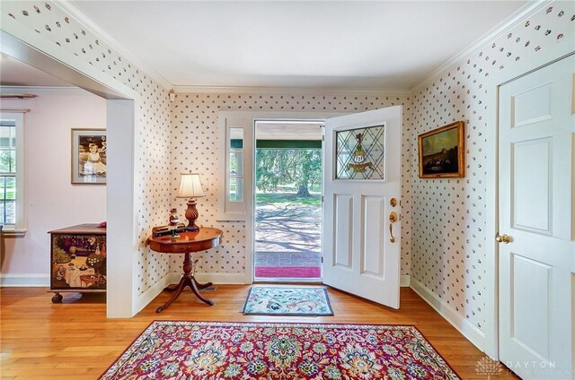 4600 Brown Rd, Sugarcreek Township, OH 45440 - entryway featuring ornamental molding, wood finished floors, baseboards, and wallpapered walls