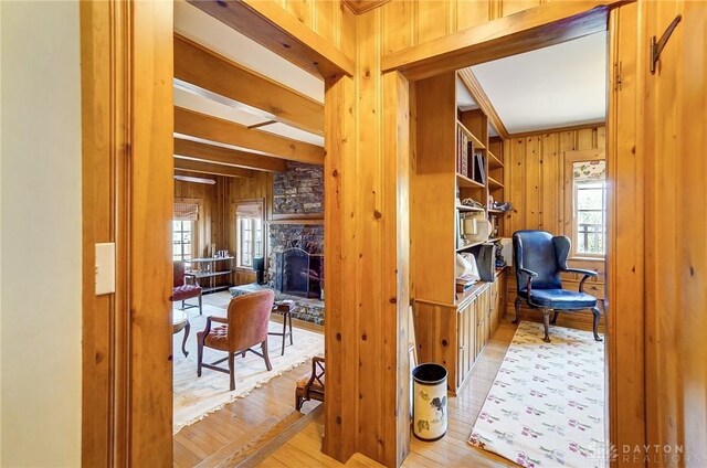 4600 Brown Rd, Sugarcreek Township, OH 45440 - office with wooden walls, healthy amount of natural light, light wood-style flooring, and a stone fireplace