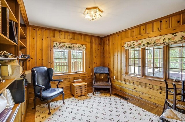 4600 Brown Rd, Sugarcreek Township, OH 45440 - living area featuring wood walls and ornamental molding