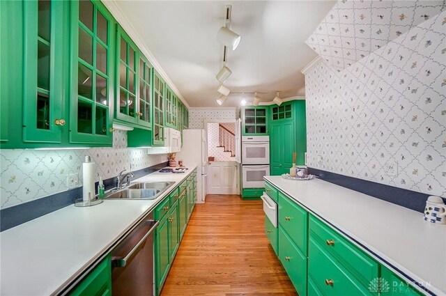 4600 Brown Rd, Sugarcreek Township, OH 45440 - kitchen with wallpapered walls, a sink, green cabinetry, white appliances, and light wood-type flooring