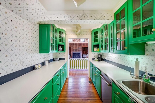 4600 Brown Rd, Sugarcreek Township, OH 45440 - kitchen with green cabinetry, dark wood-type flooring, stainless steel dishwasher, ornamental molding, and a sink