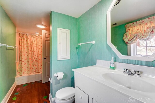 4600 Brown Rd, Sugarcreek Township, OH 45440 - bathroom featuring vanity, wood finished floors, toilet, and curtained shower