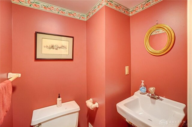 4600 Brown Rd, Sugarcreek Township, OH 45440 - half bathroom with a sink and toilet