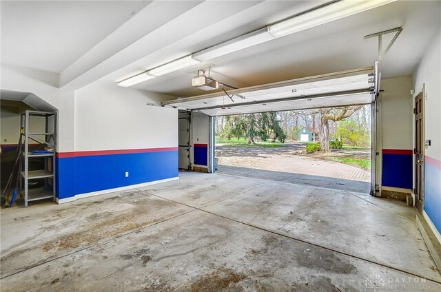 4600 Brown Rd, Sugarcreek Township, OH 45440 - garage with a garage door opener and baseboards