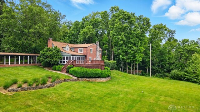 4600 Brown Rd, Sugarcreek Township, OH 45440 - view of green lawn with a wooden deck
