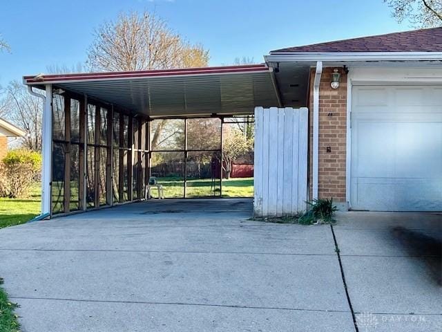 view of vehicle parking with driveway and an attached garage