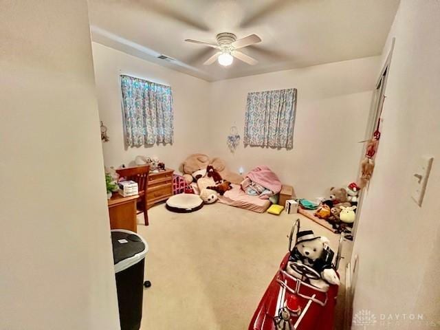 playroom with visible vents, ceiling fan, and carpet flooring