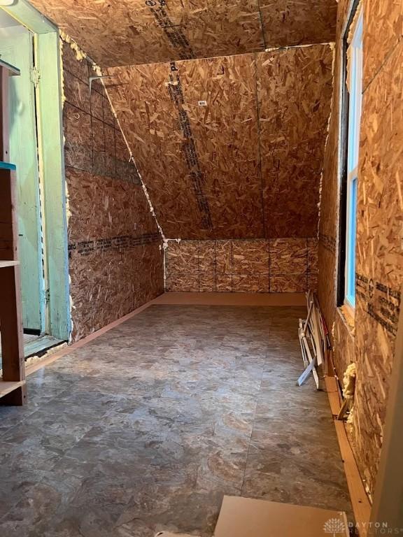 bonus room featuring vaulted ceiling