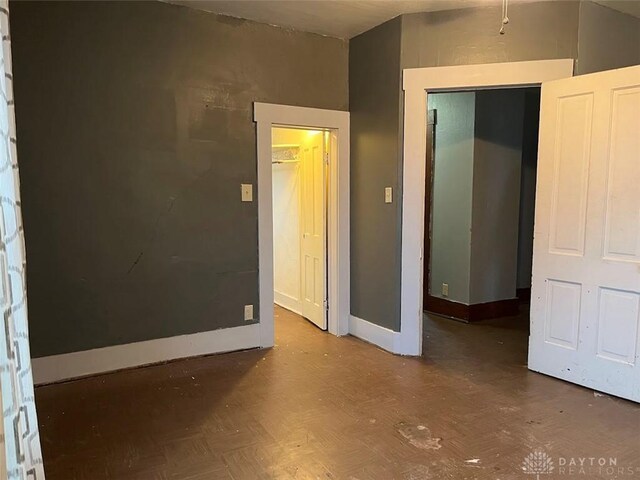 spare room with baseboards