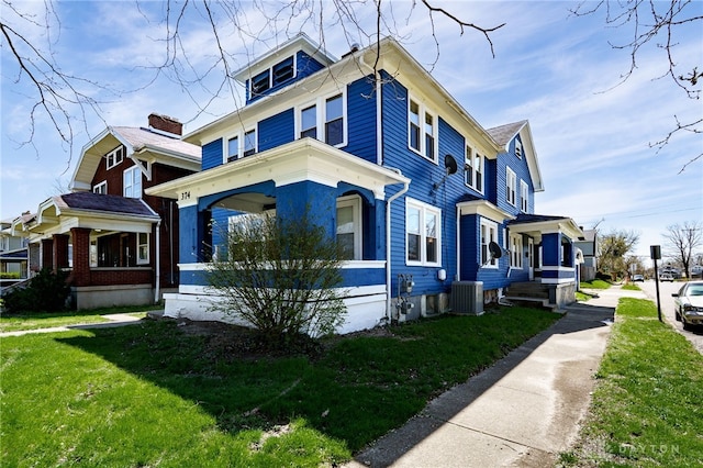 374 Kenwood Ave, Dayton, OH 45405 - view of side of home featuring a yard and a central air condition unit