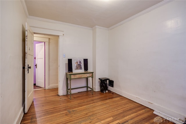 374 Kenwood Ave, Dayton, OH 45405 - unfurnished living room with crown molding and hardwood / wood-style flooring