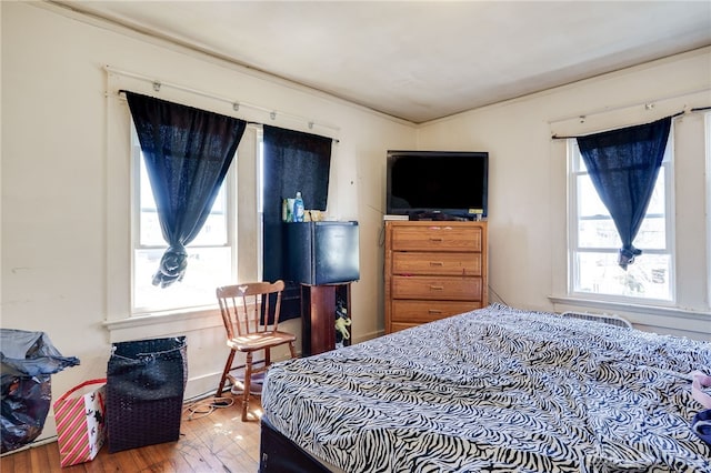 bedroom featuring wood finished floors